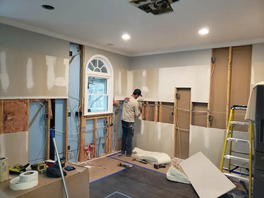 A wall opened to the studs to dry a leak in Rowan County