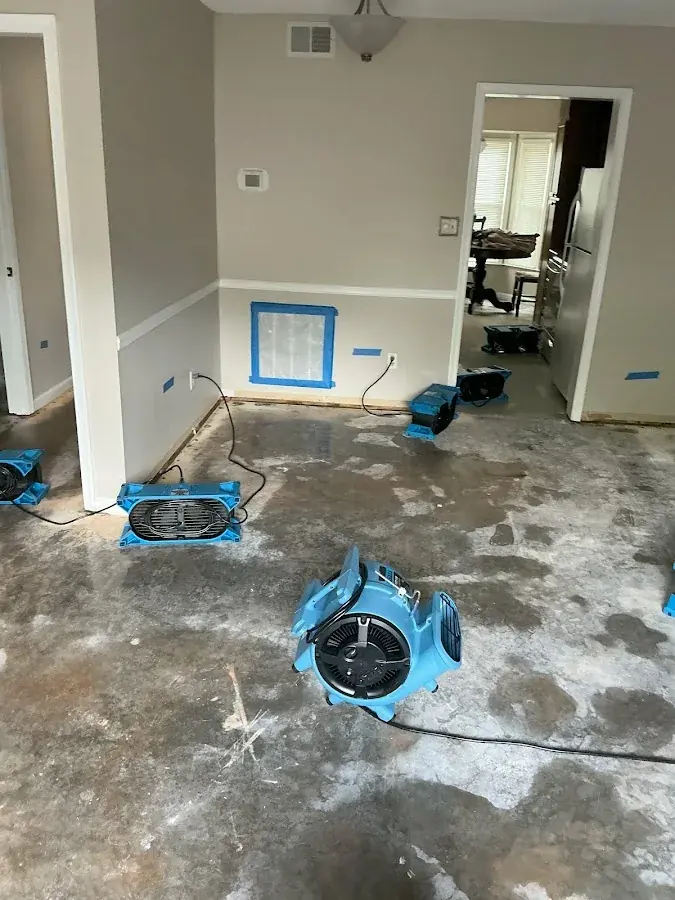 Low-profile air movers drying a concrete slab in Rowan County